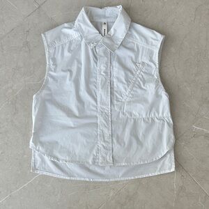 Elegant Sleeveless White Button-Down Shirt